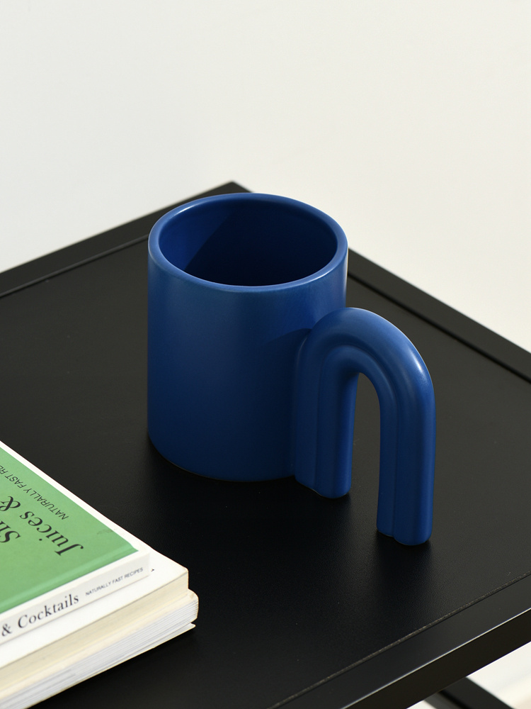 The Door Splashes Ink On The Ceramic Mug